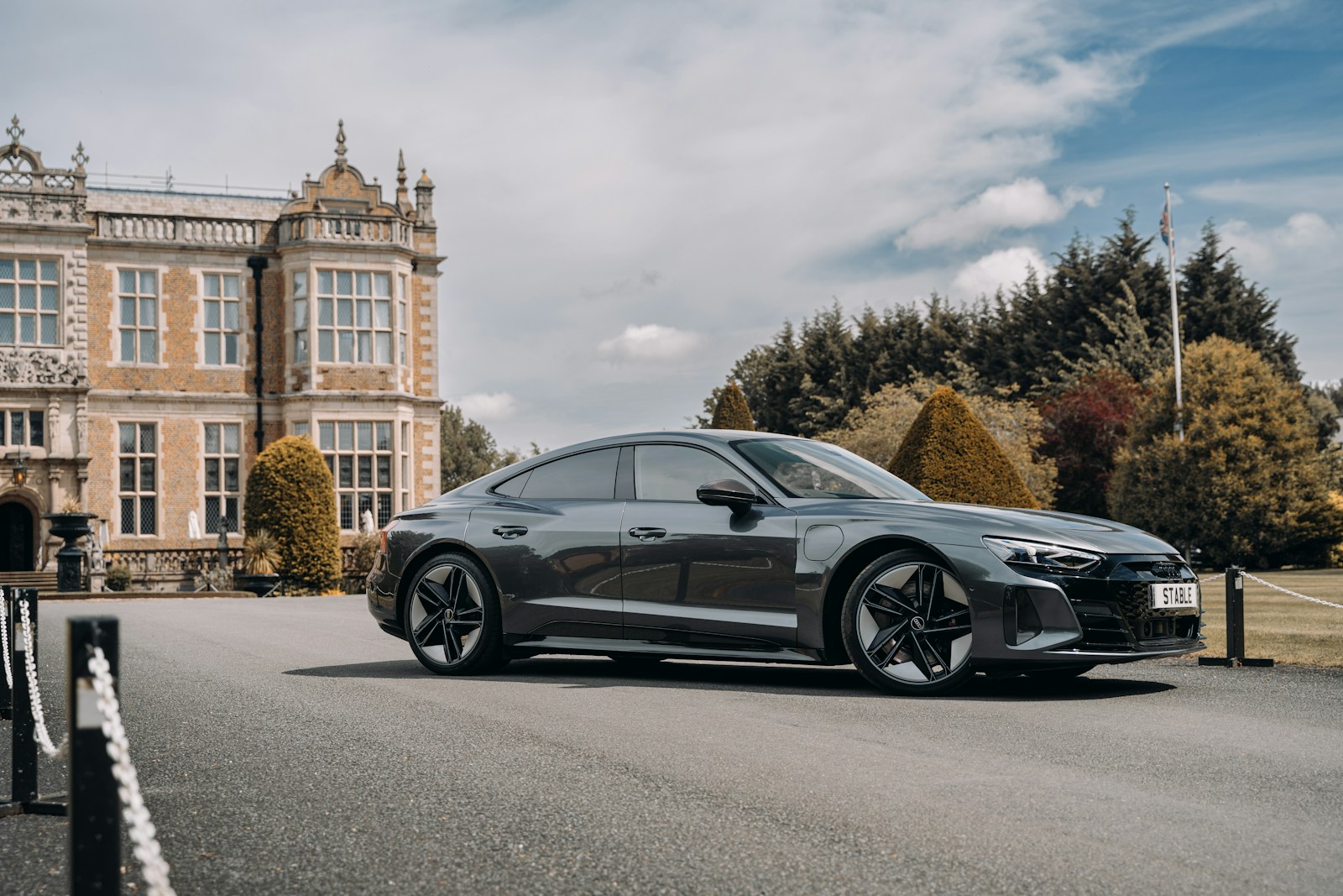 a black car parked in front of a building