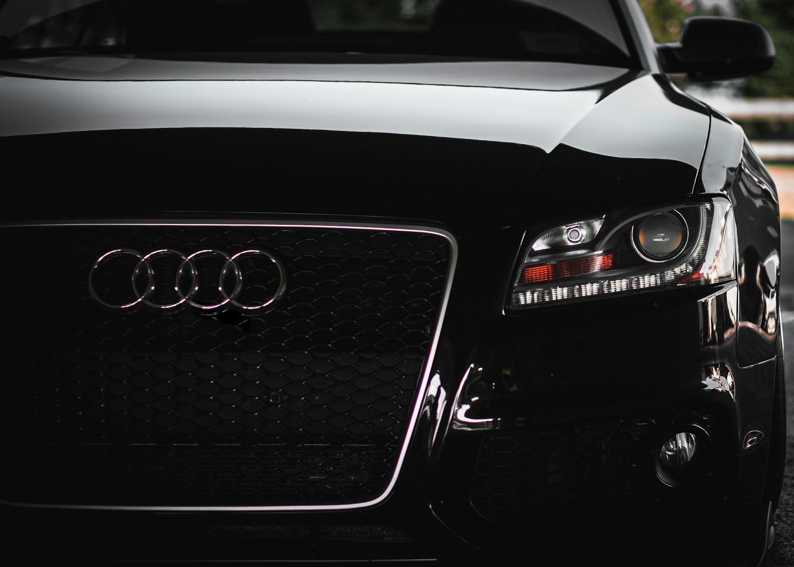 a close up of the front of a black car